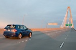 2013 BMW X5 M in Monte Carlo Blue Metallic - Driving Rear Right Three-quarter View